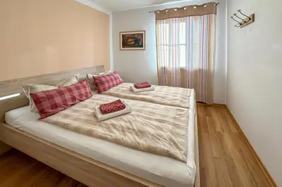 Ein Bett oder Betten in einem Zimmer der Unterkunft Chiemsee Strand