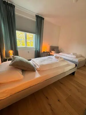 Ein Bett oder Betten in einem Zimmer der Unterkunft Bavaria Home Apartments Geisenfeld