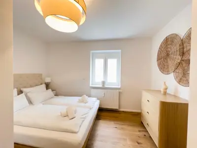 Ein Bett oder Betten in einem Zimmer der Unterkunft Exklusives City-Apartment Augsburg I Stilvoll & modern
