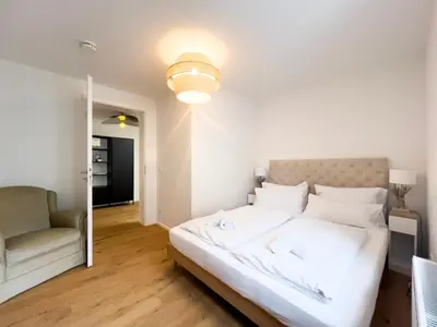 Ein Bett oder Betten in einem Zimmer der Unterkunft Exklusives City-Apartment Augsburg I Stilvoll & modern
