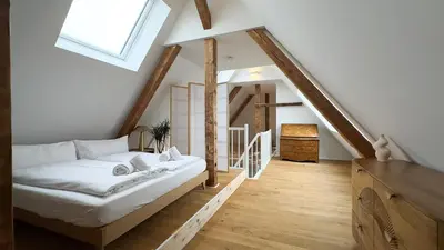 Ein Bett oder Betten in einem Zimmer der Unterkunft Modernes Maisonette-Apartment mit Terrasse I Augsburg City