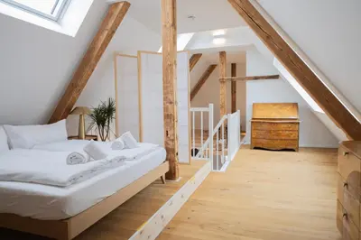 Ein Bett oder Betten in einem Zimmer der Unterkunft Modernes Maisonette-Apartment mit Terrasse I Augsburg City