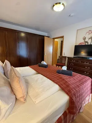 Ein Bett oder Betten in einem Zimmer der Unterkunft Ferienwohnung Anna