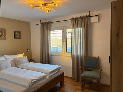 Ein Bett oder Betten in einem Zimmer der Unterkunft Ferienwohnungen Karwendulum
