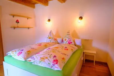 Ein Bett oder Betten in einem Zimmer der Unterkunft Zum Friedl
