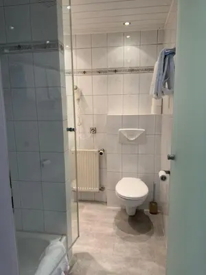 Ein Badezimmer in der Unterkunft Apartment Hotel Huber, Zimmer und Apartments