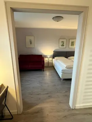 Ein Bett oder Betten in einem Zimmer der Unterkunft Apartment Hotel Huber, Zimmer und Apartments