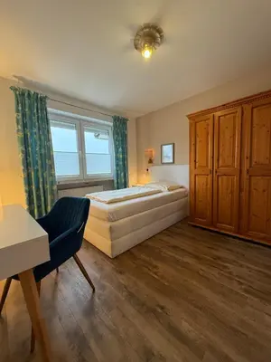 Ein Bett oder Betten in einem Zimmer der Unterkunft Apartment Hotel Huber, Zimmer und Apartments