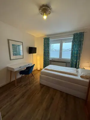 Ein Bett oder Betten in einem Zimmer der Unterkunft Apartment Hotel Huber, Zimmer und Apartments