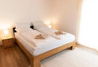 Ein Bett oder Betten in einem Zimmer der Unterkunft Gemütliche Ferienwohnung am Kochelsee