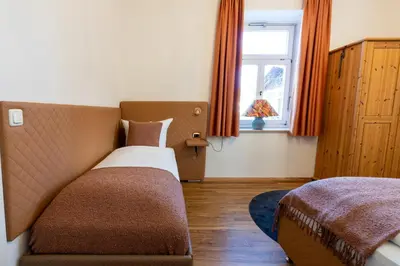 Ein Bett oder Betten in einem Zimmer der Unterkunft Höllental heritage house - Kramerblick - 2