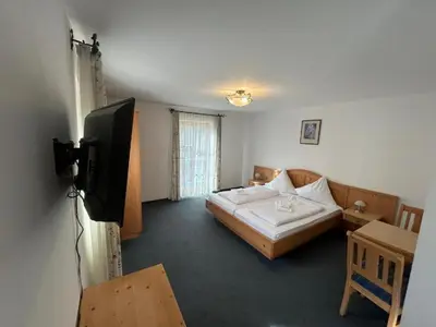 Ein Bett oder Betten in einem Zimmer der Unterkunft Hotel Gasthaus Aujäger