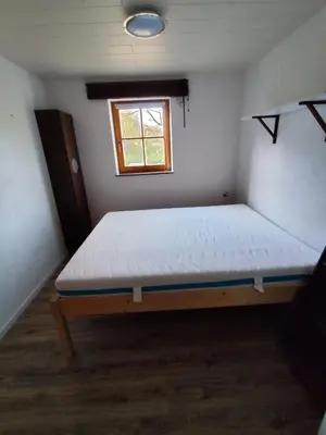 Ein Bett oder Betten in einem Zimmer der Unterkunft FeWo Pfaffenhofen-Ortsteil Blick ins Grüne