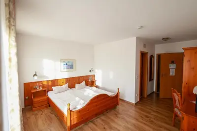 Ein Bett oder Betten in einem Zimmer der Unterkunft Brauereigasthof Gut Forsting