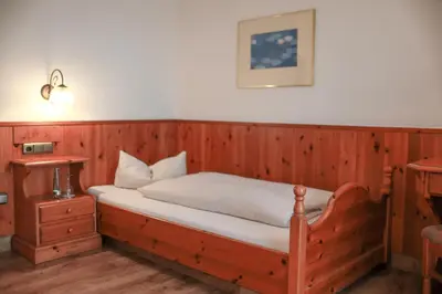 Ein Bett oder Betten in einem Zimmer der Unterkunft Brauereigasthof Gut Forsting