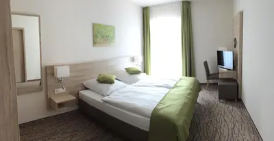 Ein Bett oder Betten in einem Zimmer der Unterkunft Landgasthof Hepting