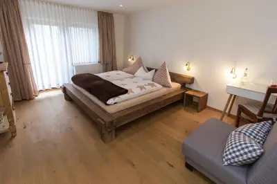 Ein Bett oder Betten in einem Zimmer der Unterkunft Hotel Alpenblick