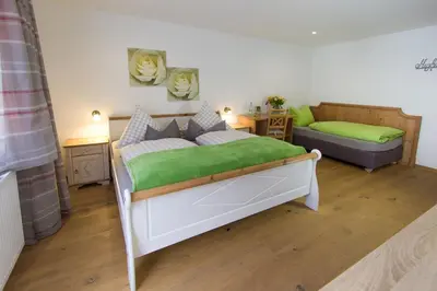 Ein Bett oder Betten in einem Zimmer der Unterkunft Hotel Alpenblick