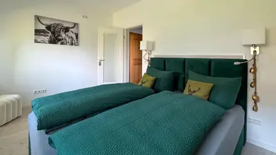 Ein Bett oder Betten in einem Zimmer der Unterkunft Alpendomizil Haberspitz