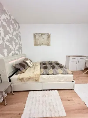Ein Bett oder Betten in einem Zimmer der Unterkunft Chiemsee-Perle, stylisches Luxus-Appartement