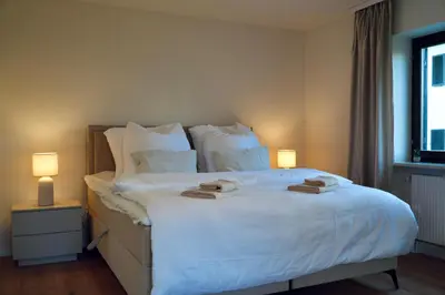 Ein Bett oder Betten in einem Zimmer der Unterkunft Chiemsee Studio - Kliniknähe I Therme & Ruhe