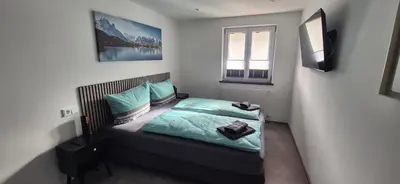 Ein Bett oder Betten in einem Zimmer der Unterkunft Ferienwohnung Alea