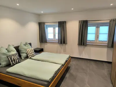 Ein Bett oder Betten in einem Zimmer der Unterkunft Bergjuwel in Bichl 120qm