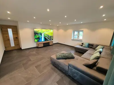 Ein Sitzbereich in der Unterkunft Bergjuwel in Bichl 120qm