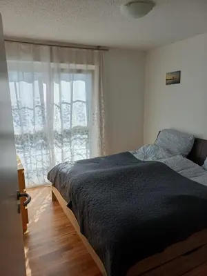 Ein Bett oder Betten in einem Zimmer der Unterkunft Helles, geräumiges Haus in München-Solln