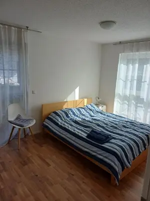 Ein Bett oder Betten in einem Zimmer der Unterkunft Helles, geräumiges Haus in München-Solln