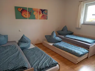 Ein Bett oder Betten in einem Zimmer der Unterkunft Ferienwohnung in Bierdorf im Erdgeschoss