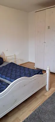 Ein Bett oder Betten in einem Zimmer der Unterkunft Ferienwohnung in Bierdorf im Erdgeschoss