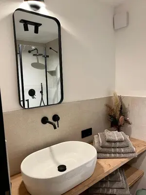 Ein Badezimmer in der Unterkunft Pittino Gartensuite 03 in zweiter Seereihe Ammersee
