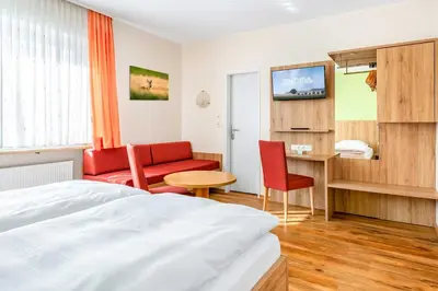 Ein Bett oder Betten in einem Zimmer der Unterkunft Hotel Pension Fruth