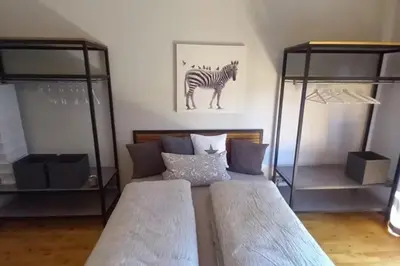 Ein Bett oder Betten in einem Zimmer der Unterkunft NEU! Ferienwohnung Design 2 Wasserburger Land