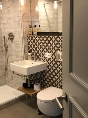 Ein Badezimmer in der Unterkunft GRUNDLERS - Gästehaus am See