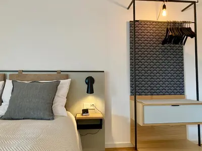 Ein Bett oder Betten in einem Zimmer der Unterkunft GRUNDLERS - Gästehaus am See
