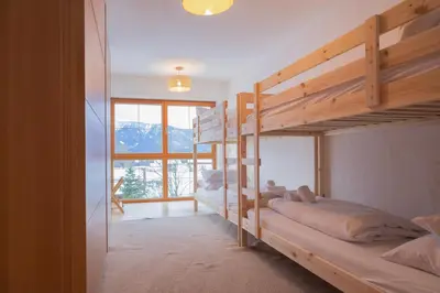 Ein Bett oder Betten in einem Zimmer der Unterkunft ღLiboria I Riegsee-Hagen Helles Refugium mit Bergblick