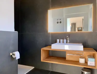 Ein Badezimmer in der Unterkunft QC Quartier Chiemsee Hotel
