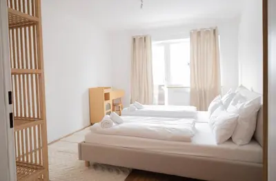 Ein Bett oder Betten in einem Zimmer der Unterkunft Holiday rental Eschenlohe, Balcony Apartment with Mountain Views