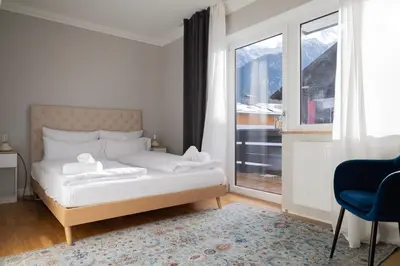 Ein Bett oder Betten in einem Zimmer der Unterkunft Holiday rental I Eschenlohe, Spacious Group Apartment, Mountain View