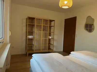 Ein Bett oder Betten in einem Zimmer der Unterkunft Terrassenwohnung in ruhiger Lage -3 Zimmer A96 nähe