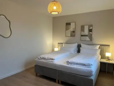 Ein Bett oder Betten in einem Zimmer der Unterkunft Terrassenwohnung in ruhiger Lage -3 Zimmer A96 nähe