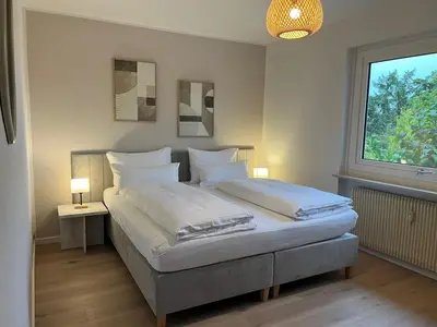 Ein Bett oder Betten in einem Zimmer der Unterkunft Terrassenwohnung in ruhiger Lage -3 Zimmer A96 nähe