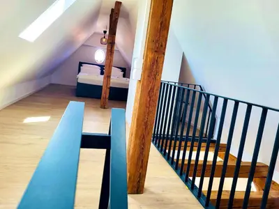 Ein Bett oder Betten in einem Zimmer der Unterkunft EDEN - Penthouse-Loft über den Dächern Kaufbeurens