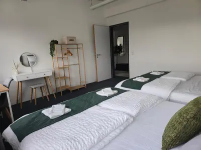 Ein Bett oder Betten in einem Zimmer der Unterkunft Große Wohnung mit Balkon nahe München