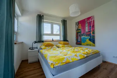 Ein Bett oder Betten in einem Zimmer der Unterkunft Ammersee-Nest Dießen