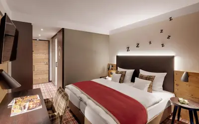 Ein Bett oder Betten in einem Zimmer der Unterkunft Hotel Traumschmiede