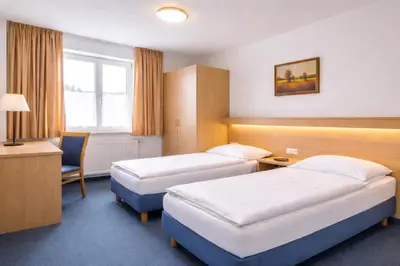 Ein Bett oder Betten in einem Zimmer der Unterkunft Hotel Wendelstein München City