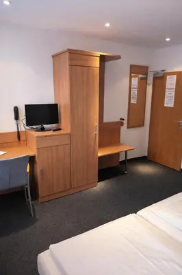 Ein Bett oder Betten in einem Zimmer der Unterkunft Hotel Wendelstein München City